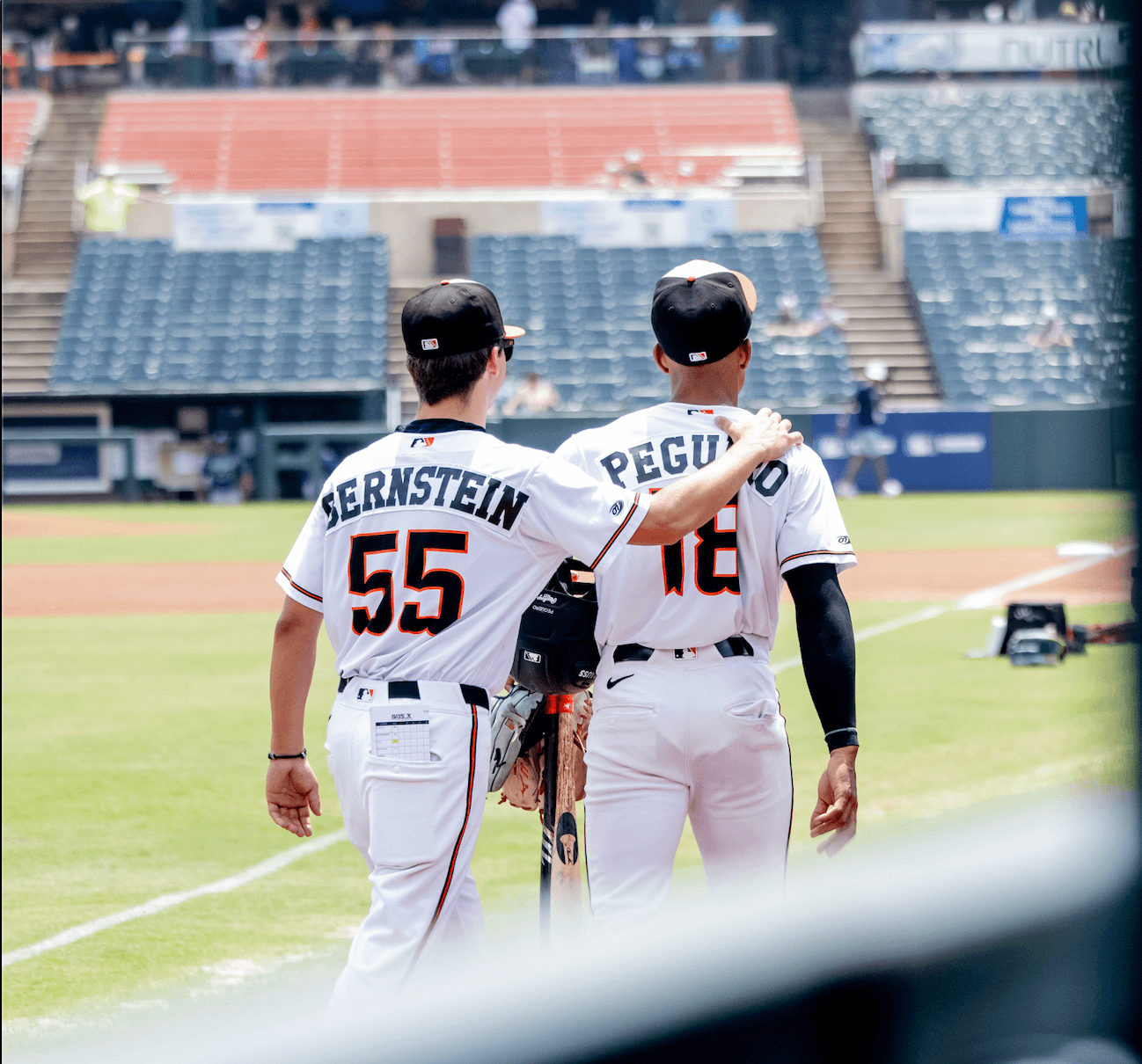 Coach Bernie working during a professional baseball game